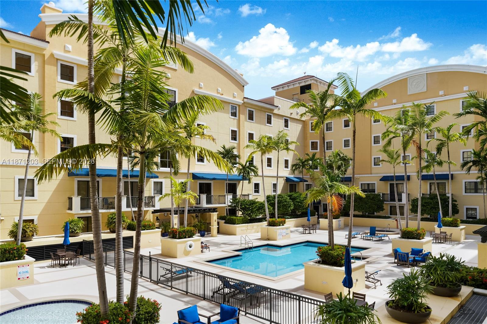 8395 Southwest 73rd Avenue, Unit 511 Miami, FL 33143 - Photo 15 of 18 a view of a patio with couches table and chairs and potted plants