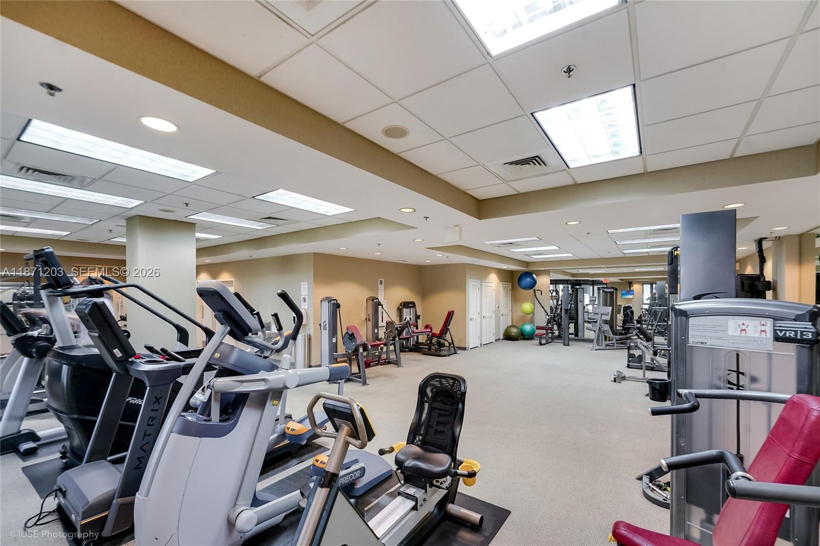 8395 Southwest 73rd Avenue, Unit 511 Miami, FL 33143 - Photo 16 of 18 a view of a room with gym equipment