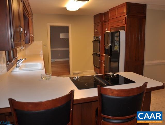 2355 Cinnamon Ridge Road Charlottesville, VA 22901 - Photo 16 of 36 a room with table and chairs