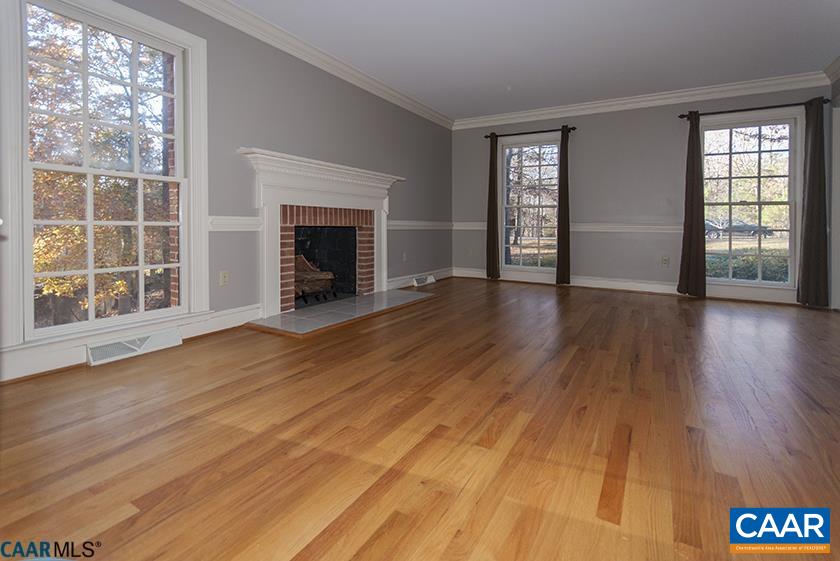 2355 Cinnamon Ridge Road Charlottesville, VA 22901 - Photo 7 of 36 a view of an empty room with wooden floor and a window