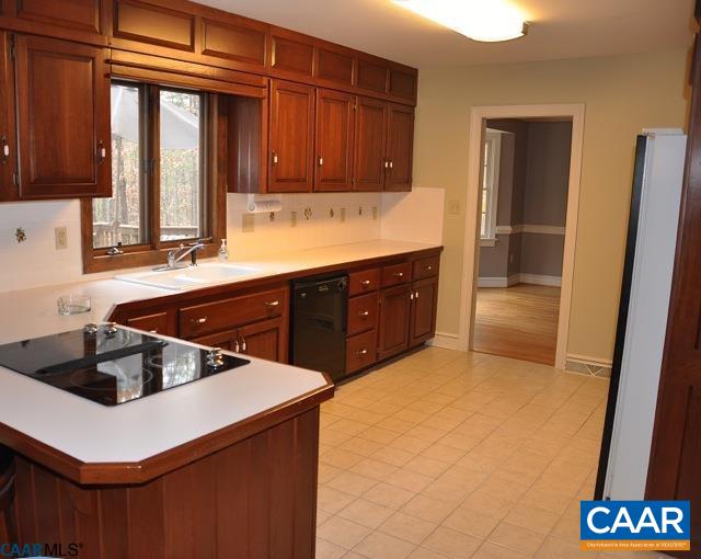 2355 Cinnamon Ridge Road Charlottesville, VA 22901 - Photo 9 of 36 a kitchen with a sink and cabinets