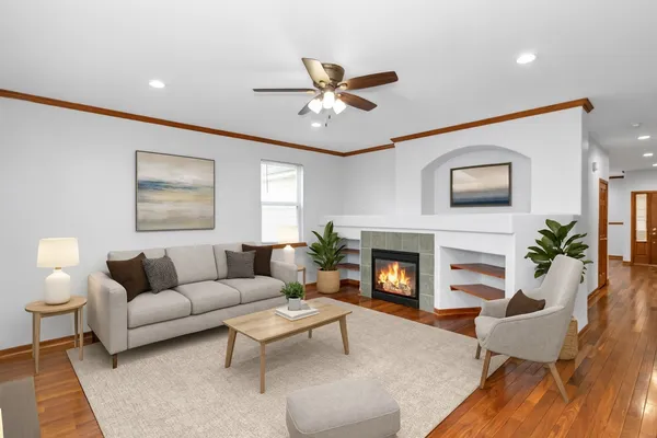 a living room with furniture and a fireplace