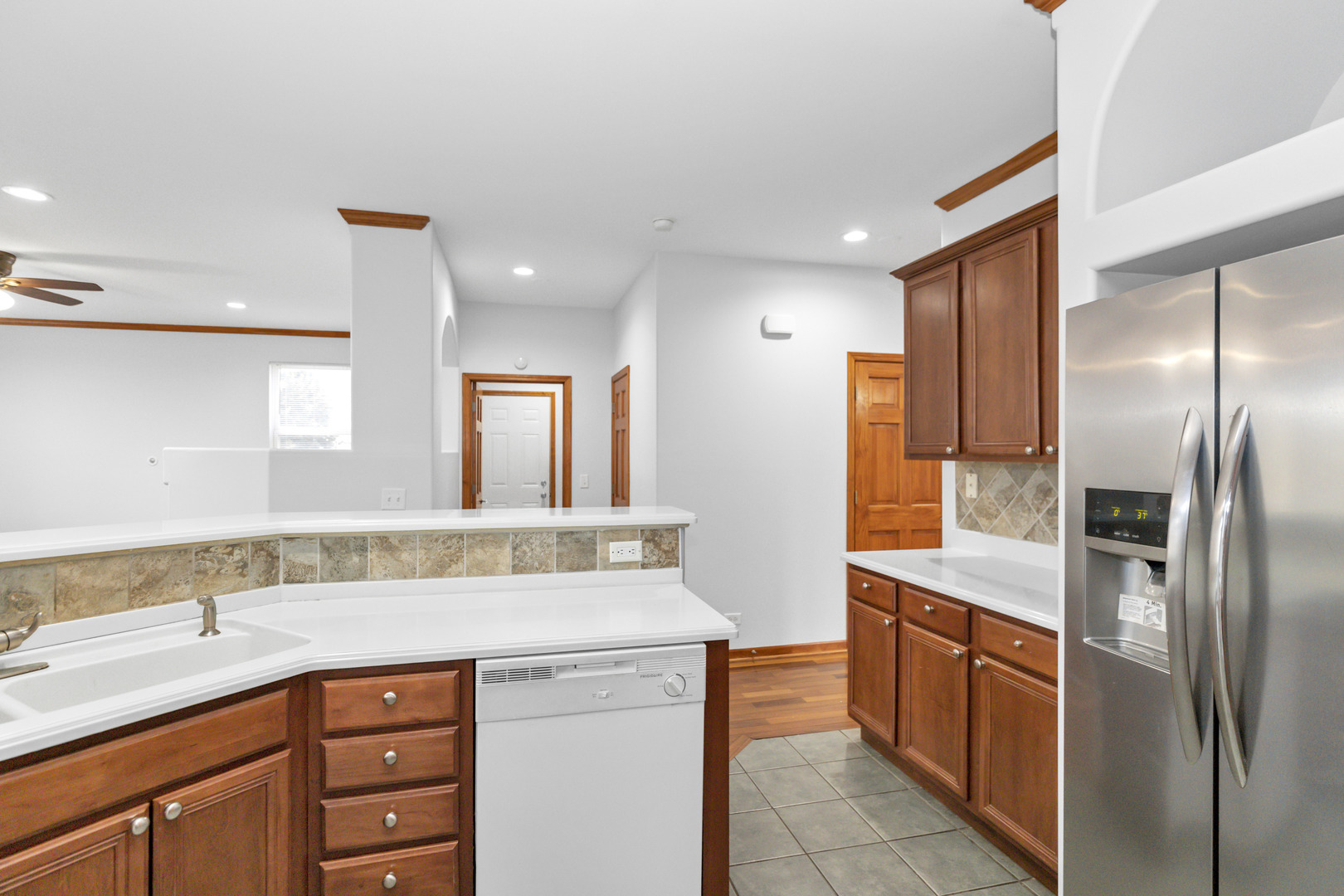 3311 Lafayette Street Elgin, IL 60124 - Photo 23 of 50 a kitchen with stainless steel appliances granite countertop a sink and a refrigerator