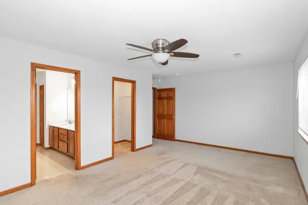 a view of a livingroom with a chandelier fan