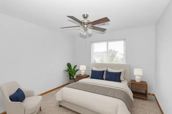 a bedroom with a bed and window