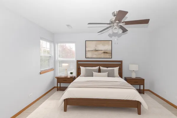 a bedroom with a bed and window