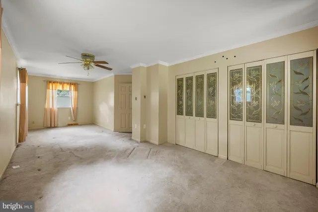 a view of empty room with windows