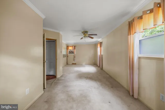 a view of a hallway with wooden shelves