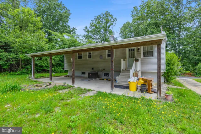 a view of a chair and tables in the garden
