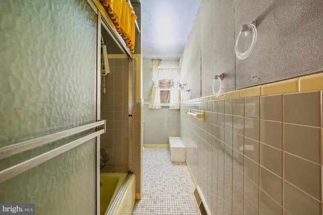 a bathroom with a shower and a sink