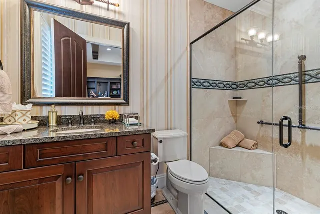 a kitchen with stainless steel appliances kitchen island granite countertop a stove and cabinets