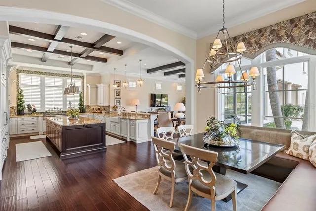 a bedroom with a bed and a flat tv screen on dresser