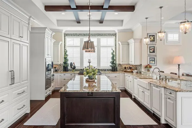 a utility room with sink dryer and washer