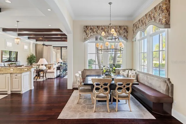 a bedroom with bed and a large window