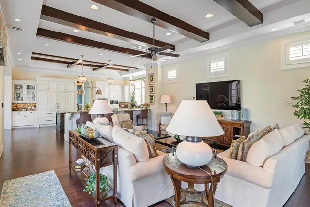a bedroom with furniture and a large window