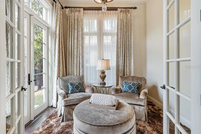 a bathroom with a granite countertop double vanity sink a mirror and a bathtub