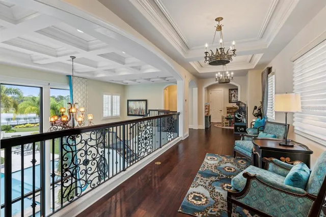 a spacious bedroom with a bed and ceiling fan