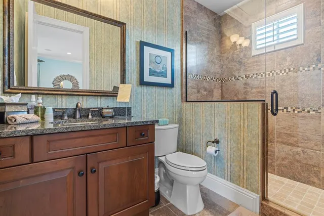 a view of a house with patio and a garden