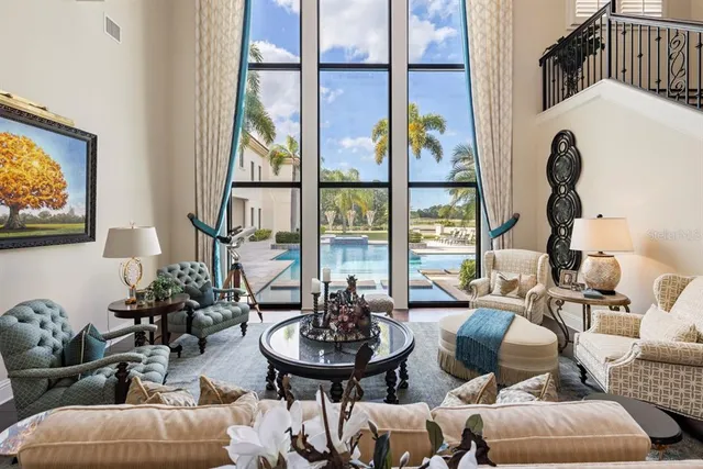 a view of a livingroom with furniture entryway and wooden floor