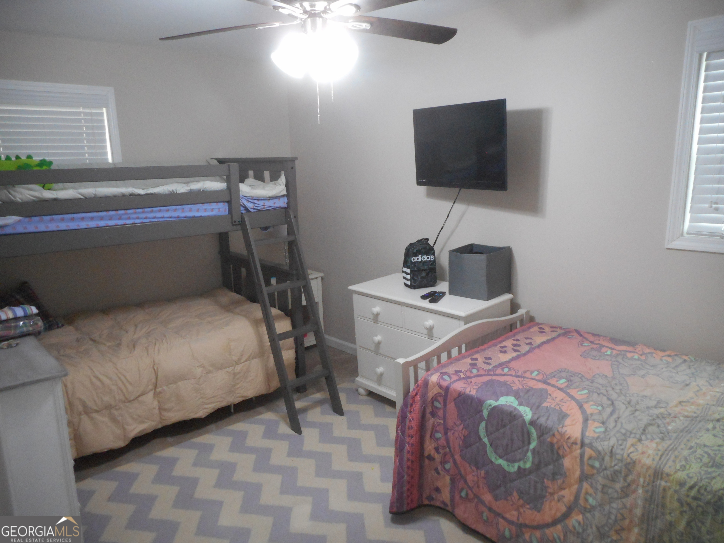 530 Grandview Avenue Mount Airy, GA 30563 - Photo 13 of 20 a bedroom with a bed and a flat screen tv