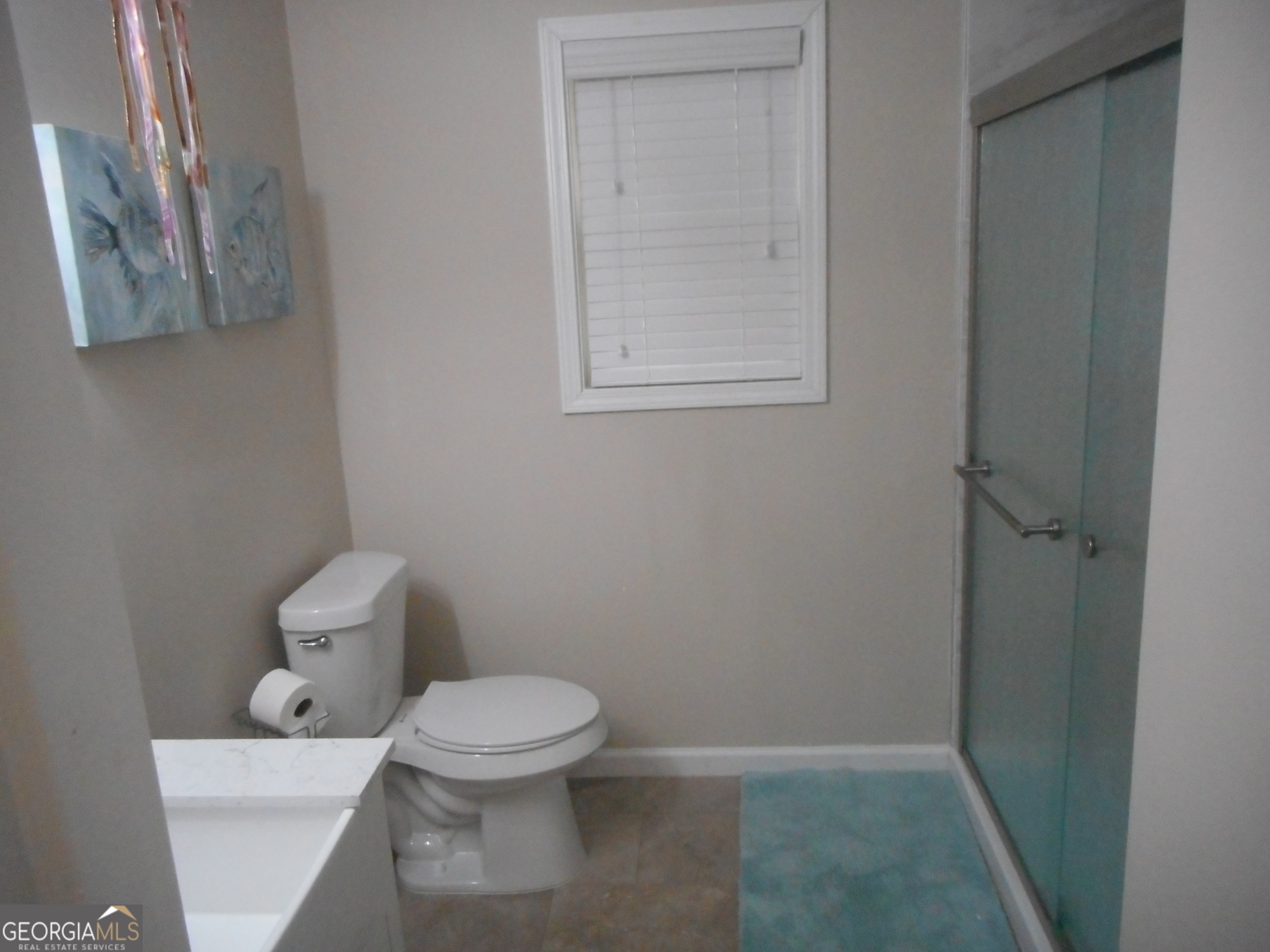 530 Grandview Avenue Mount Airy, GA 30563 - Photo 14 of 20 a white toilet sitting next to a bathroom sink