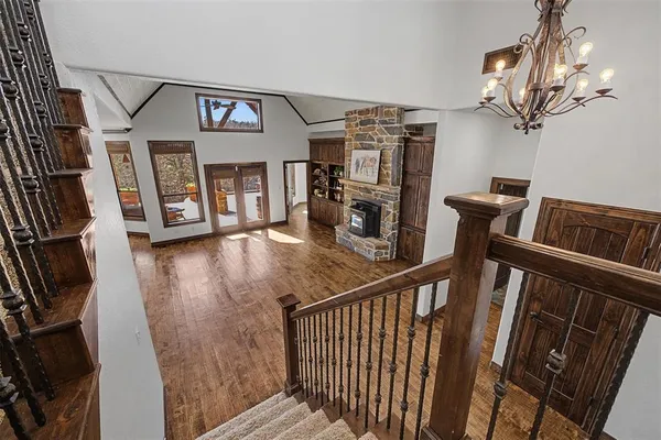 a view of a porch with wooden floor and windows