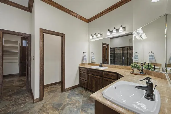 a kitchen with a sink and refrigerator
