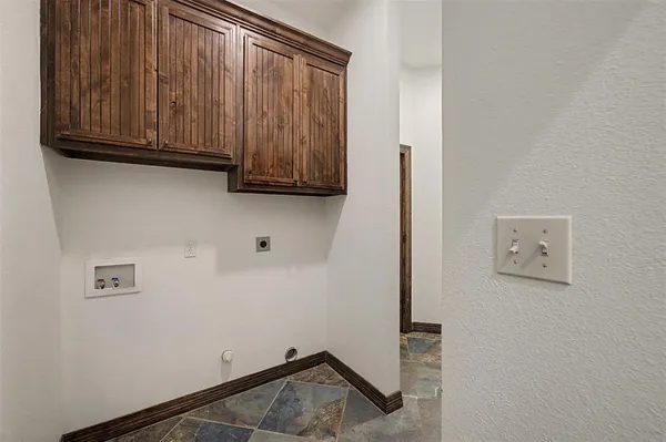 a view of door with cabinets