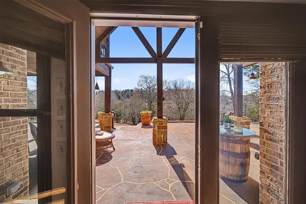 a porch with a glass door and glass door