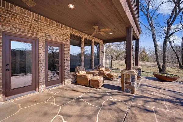 a bedroom with furniture and large windows