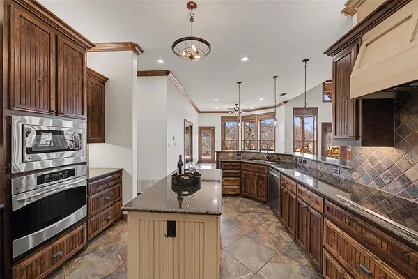 a kitchen with a stove and a refrigerator