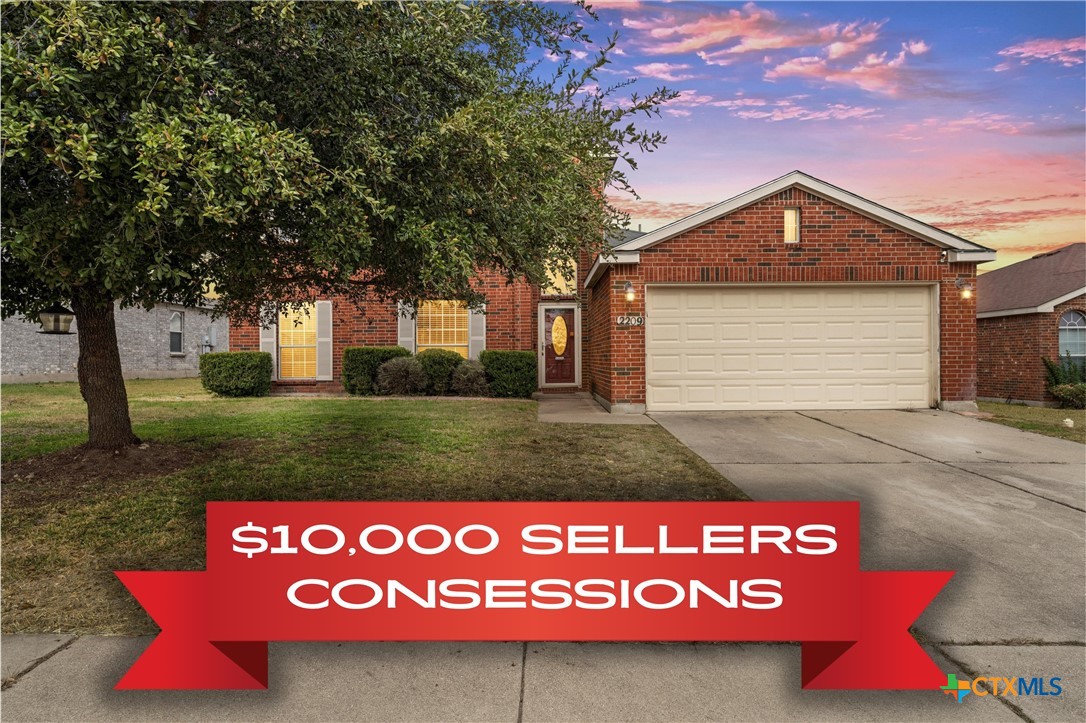 a sign that is sitting on a brick wall