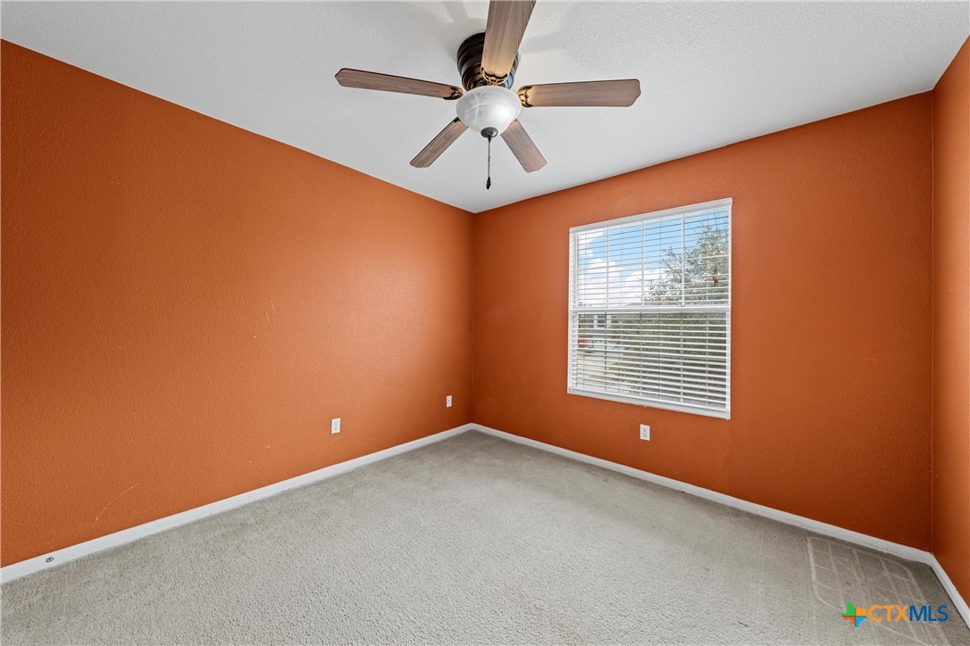 2209 Riley Drive Killeen, TX 76542 - Photo 22 of 33 an empty room with a ceiling fan and a window
