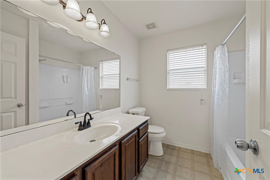 2209 Riley Drive Killeen, TX 76542 - Photo 25 of 33 a bathroom with a sink double vanity and a mirror
