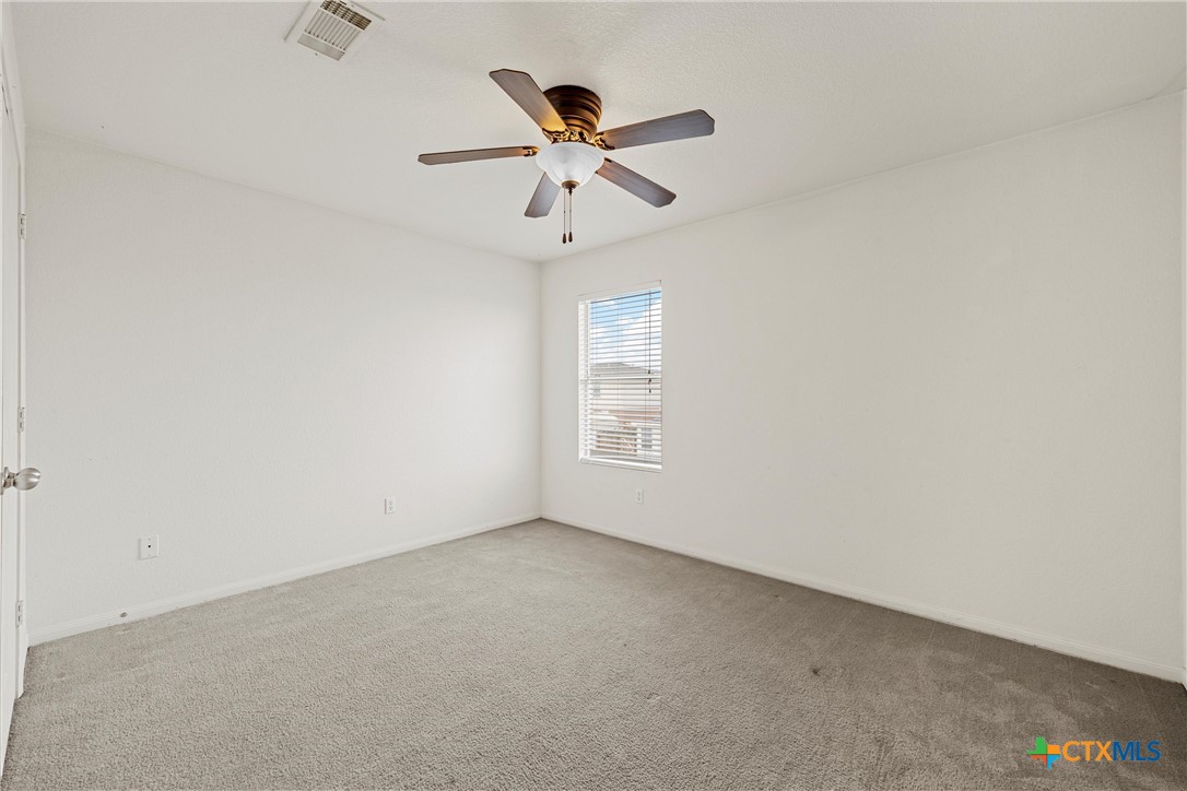 2209 Riley Drive Killeen, TX 76542 - Photo 26 of 33 an empty room with ceiling fan and window