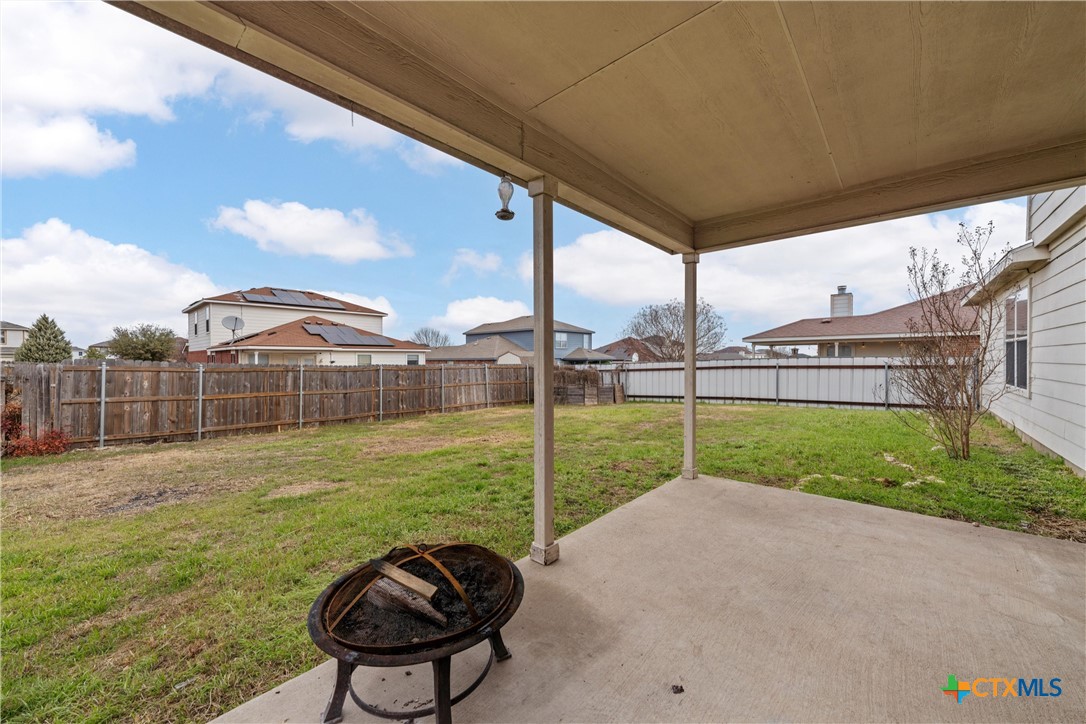 2209 Riley Drive Killeen, TX 76542 - Photo 29 of 33 a view of a backyard with table and chairs and wooden fence