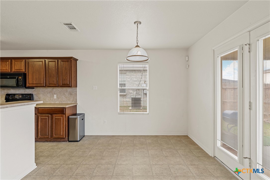 2209 Riley Drive Killeen, TX 76542 - Photo 10 of 33 a view of a kitchen with a stove cabinets and a windows