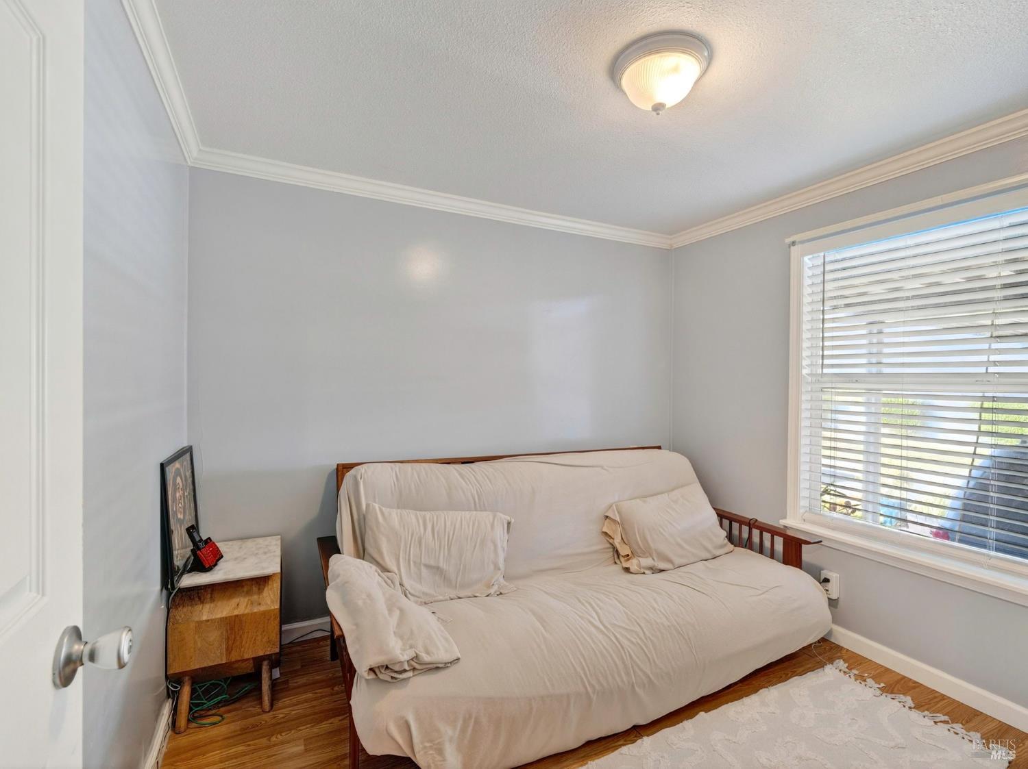 2963 Santa Rosa Avenue, Unit C6 Santa Rosa, CA 95407 - Photo 32 of 35 a bedroom with a bed and a window