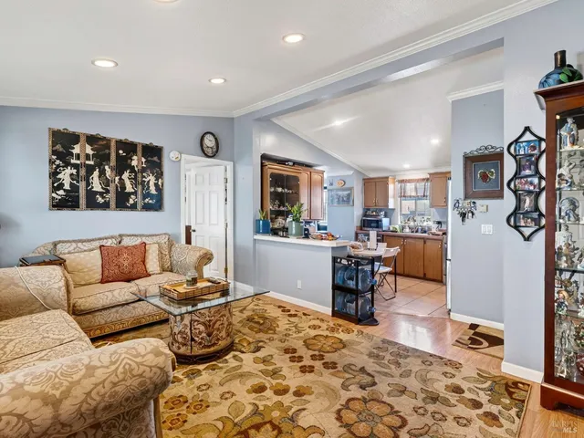 a kitchen with refrigerator and cabinets