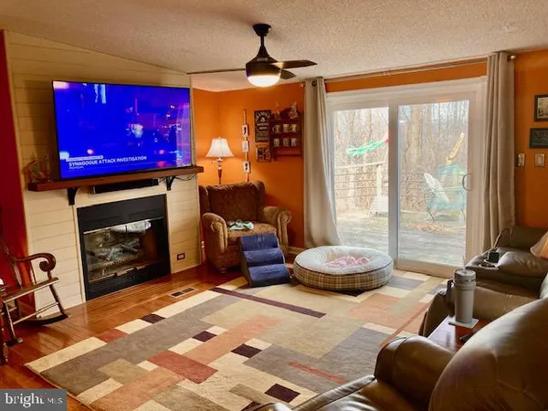 a bedroom with furniture and a fireplace