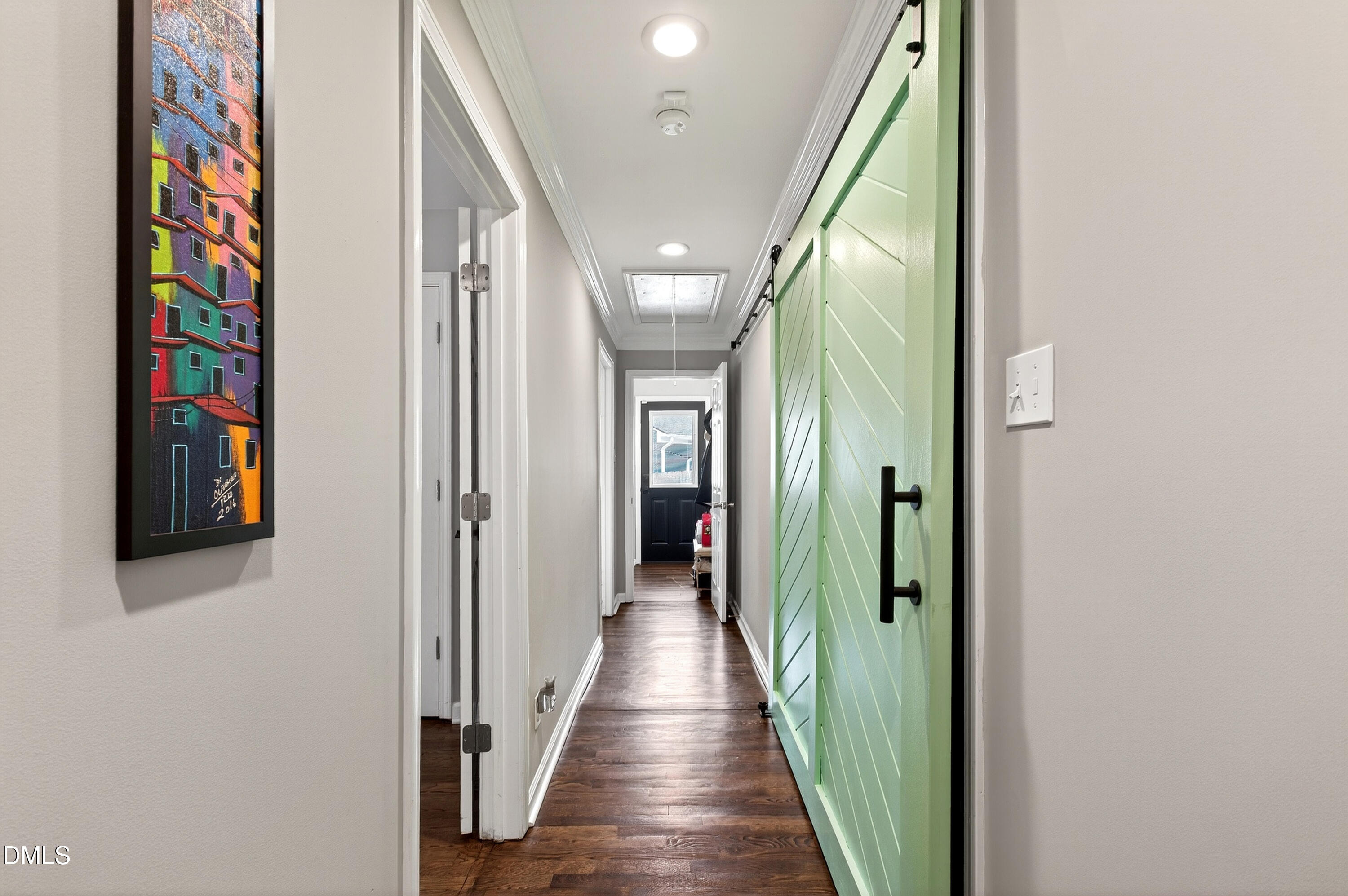 605 Chatham Lane Raleigh, NC 27610 - Photo 16 of 40 a view of a hallway with wooden floor and stairs