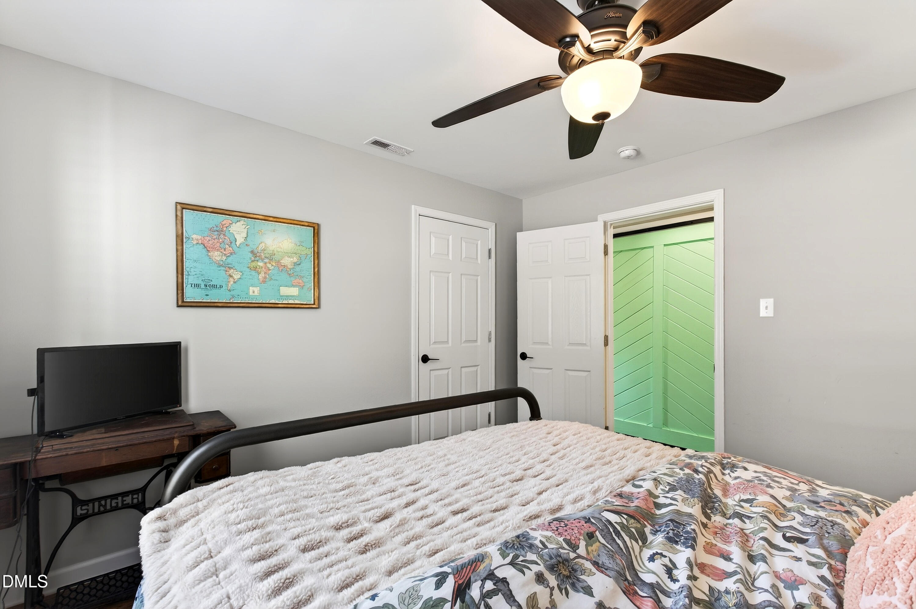 605 Chatham Lane Raleigh, NC 27610 - Photo 28 of 40 a bedroom with a bed and a flat screen tv