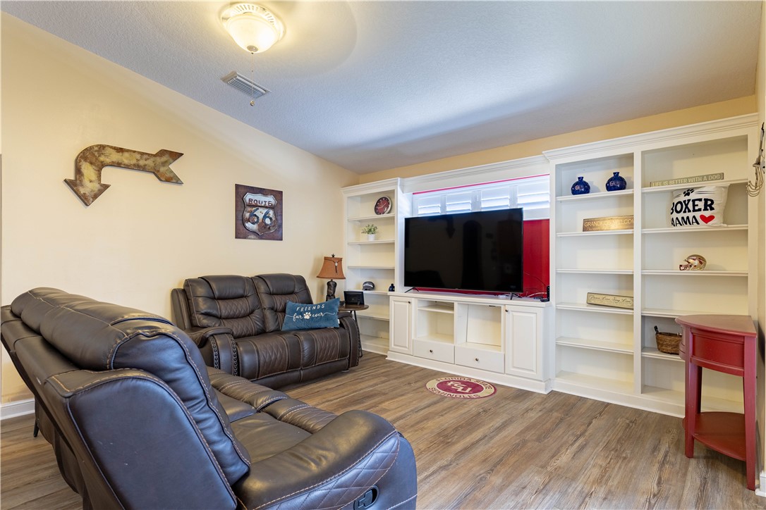 152 35th Square Southwest Vero Beach, FL 32968 - Photo 13 of 35 a living room with furniture and a flat screen tv