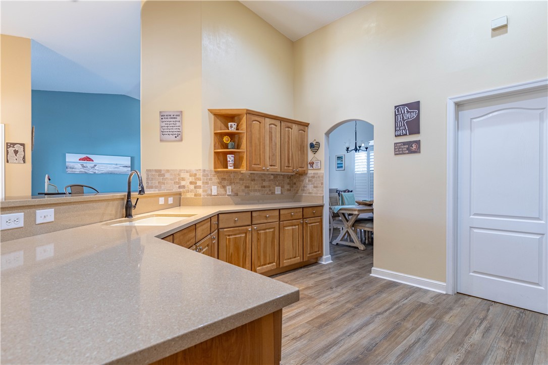 152 35th Square Southwest Vero Beach, FL 32968 - Photo 17 of 35 a kitchen with wooden floors and appliances