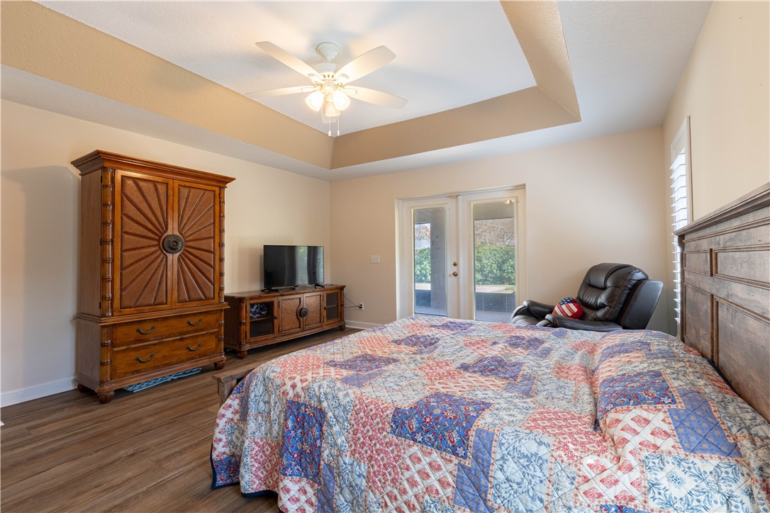 152 35th Square Southwest Vero Beach, FL 32968 - Photo 22 of 35 a bedroom with a bed and wooden floor