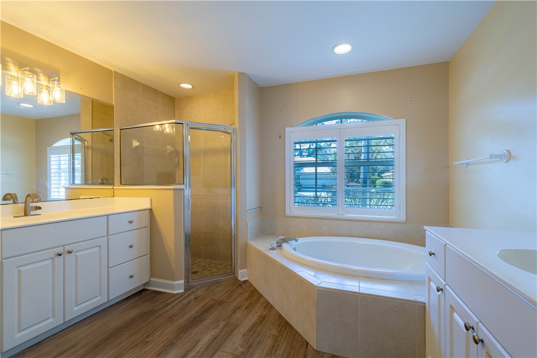 152 35th Square Southwest Vero Beach, FL 32968 - Photo 23 of 35 a spacious bathroom with a granite countertop sink a toilet and shower