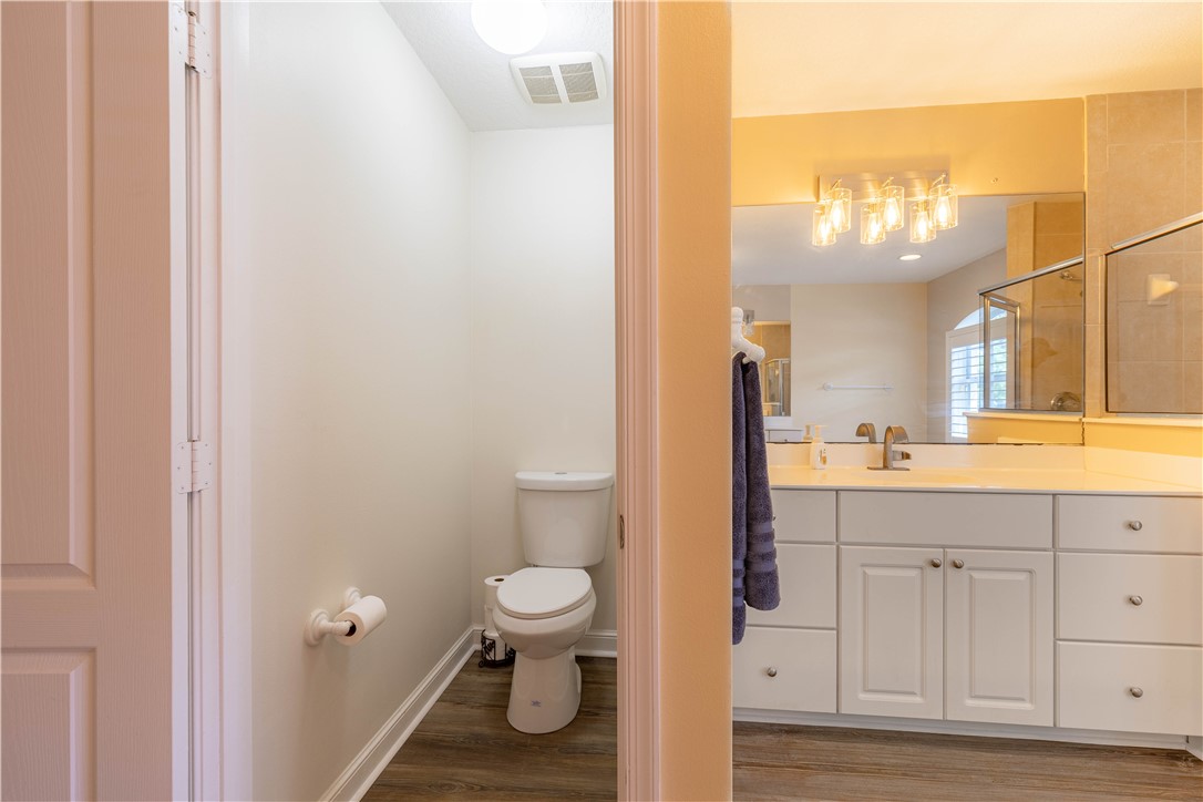 152 35th Square Southwest Vero Beach, FL 32968 - Photo 25 of 35 a bathroom with a sink a toilet and a mirror