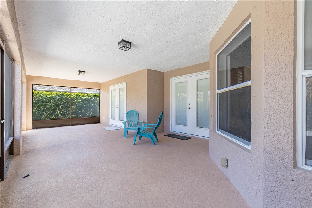 152 35th Square Southwest Vero Beach, FL 32968 - Photo 26 of 35 a view of an empty room with furniture and windows