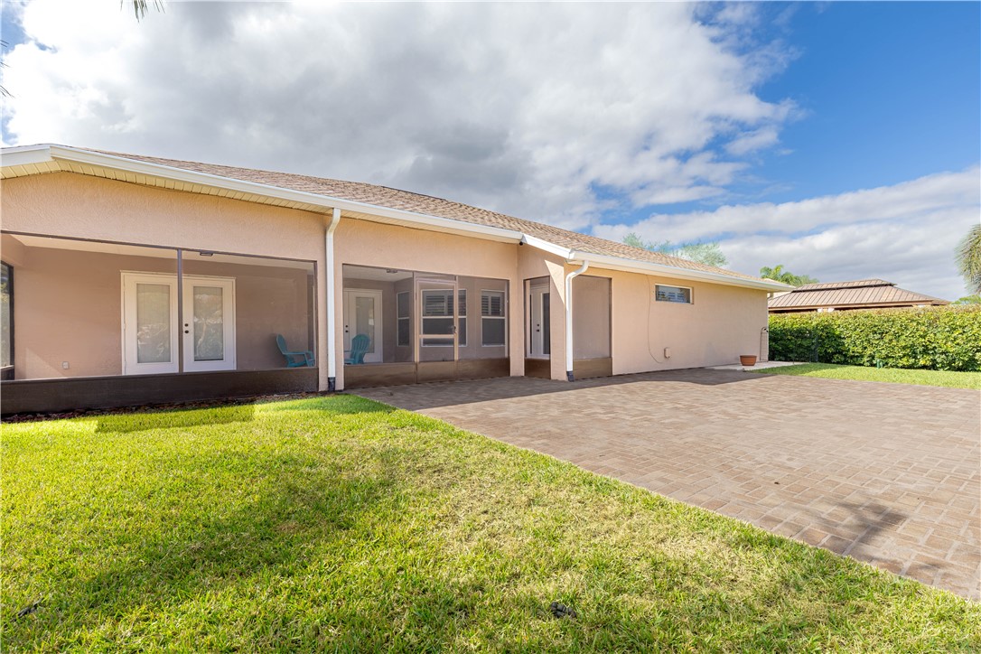 152 35th Square Southwest Vero Beach, FL 32968 - Photo 29 of 35 a view of a house with backyard and porch