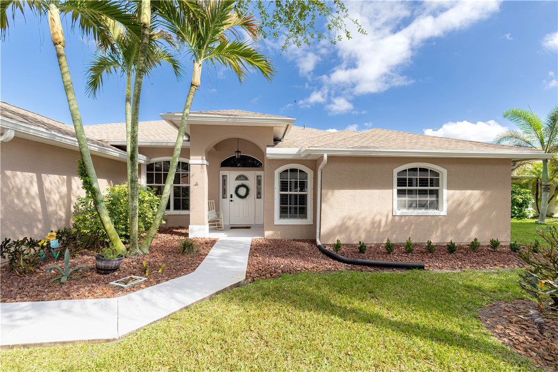 152 35th Square Southwest Vero Beach, FL 32968 - Photo 3 of 35 a view of a house with a yard